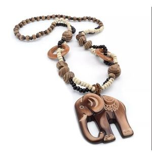 - Hand carved African grasslands necklace